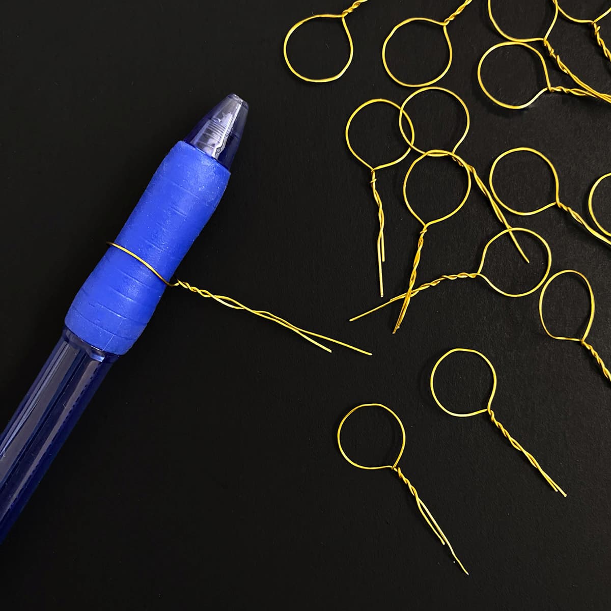 Crafting pins for DIY acorn and leaf garland, featured in Cakewalk DIY Paper Craft tutorial.