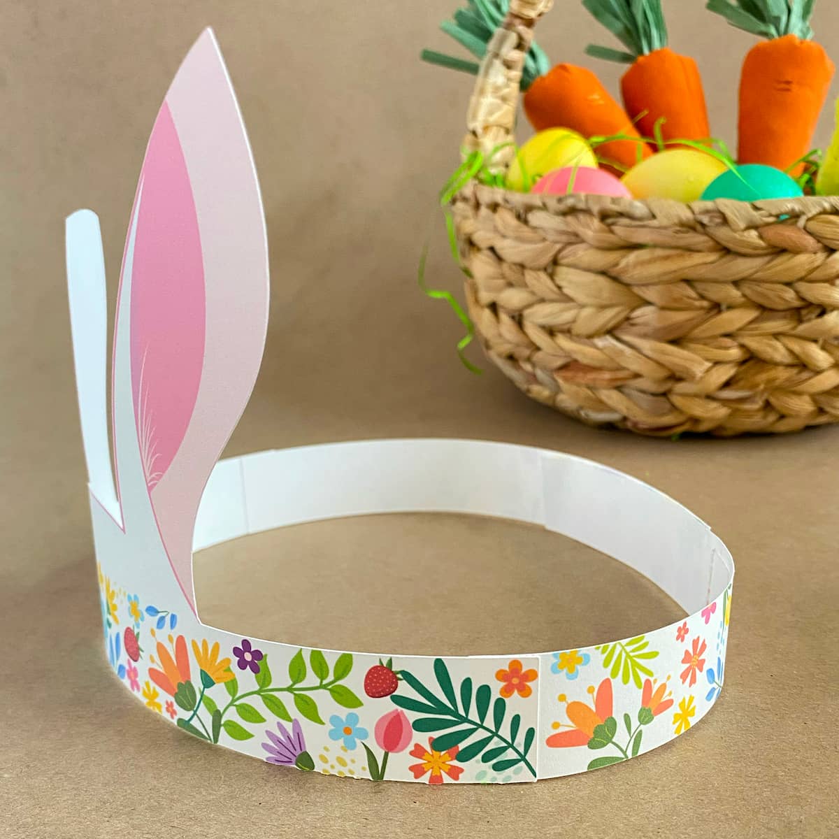 Close-up detail of colorful floral band on Easter bunny crown headband, left side